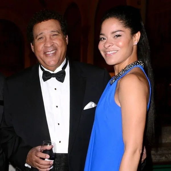 Greg Gumbel with his wife smiling